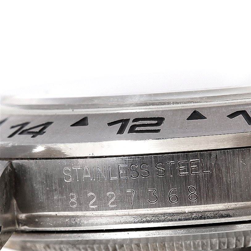 This image shows a close-up of the bezel and case with "STAINLESS STEEL" engraved on the Rolex Vintage Collection 16550 Men's Stainless Steel Beige Dial 16550 Men's Stainless Steel Beige Dial watch.