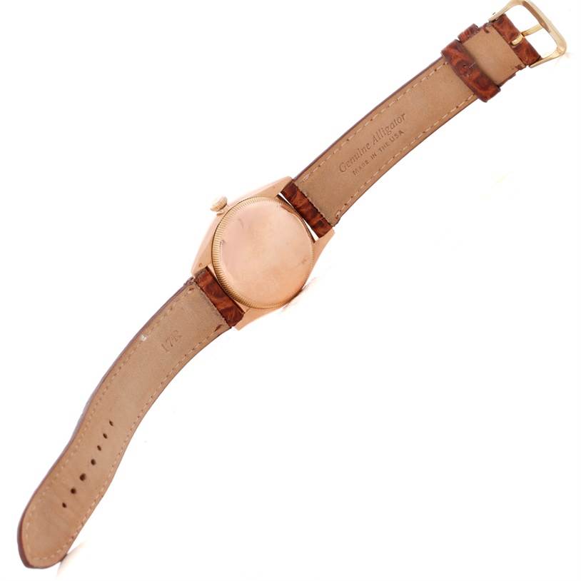 This Rolex Vintage Collection 3131 Men's Rose Gold Silver Dial 3131 Men's Rose Gold Silver Dial watch is shown from the back, displaying the strap, buckle, and the watch case back.