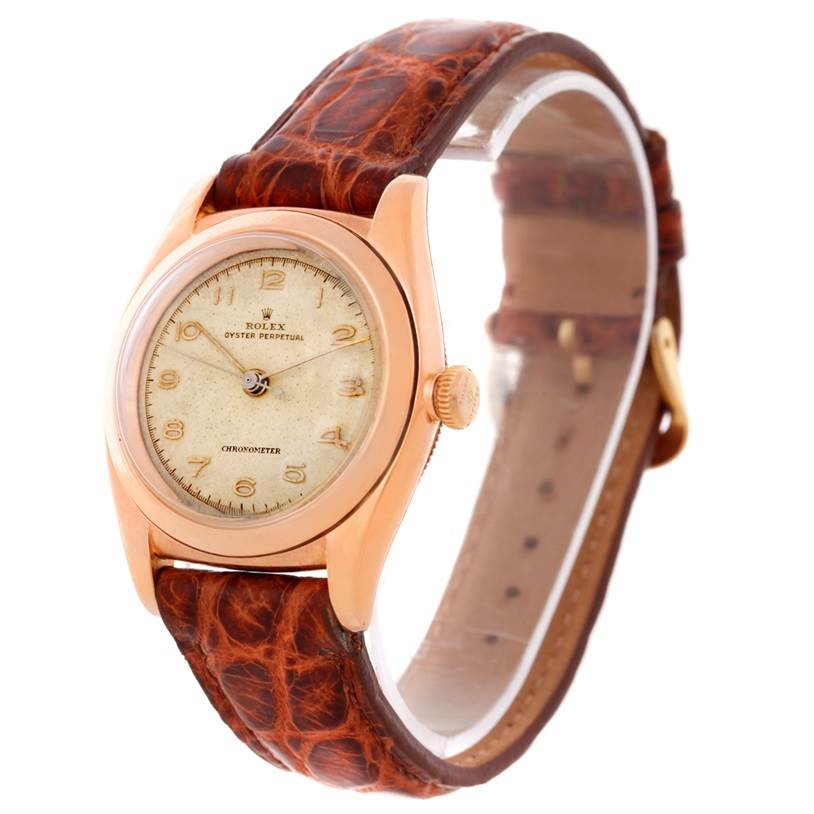 The image shows a Vintage Collection Rolex Oyster Perpetual watch at a three-quarter angle, highlighting its face, case, and leather strap.