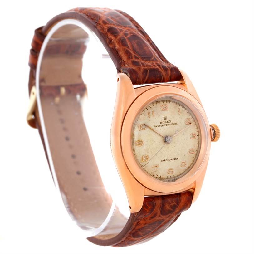 This image shows a side angle of the Vintage Collection Rolex watch, highlighting the dial, case, and leather strap.