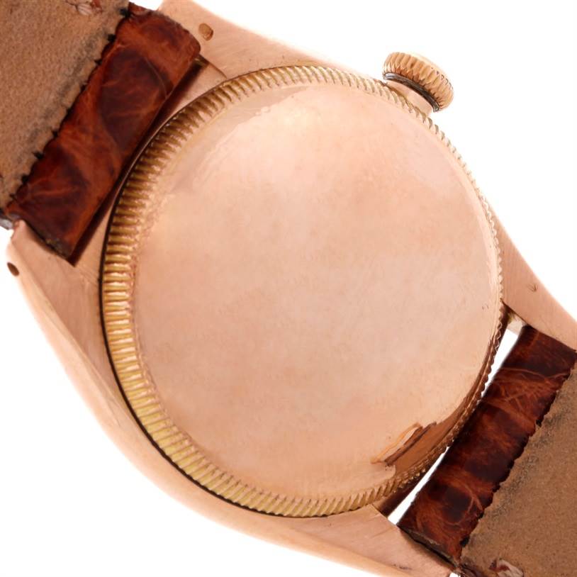 This image shows the back casing and crown of a Rolex Vintage Collection 3131 Men's Rose Gold Silver Dial 3131 Men's Rose Gold Silver Dial watch, viewed from the rear.