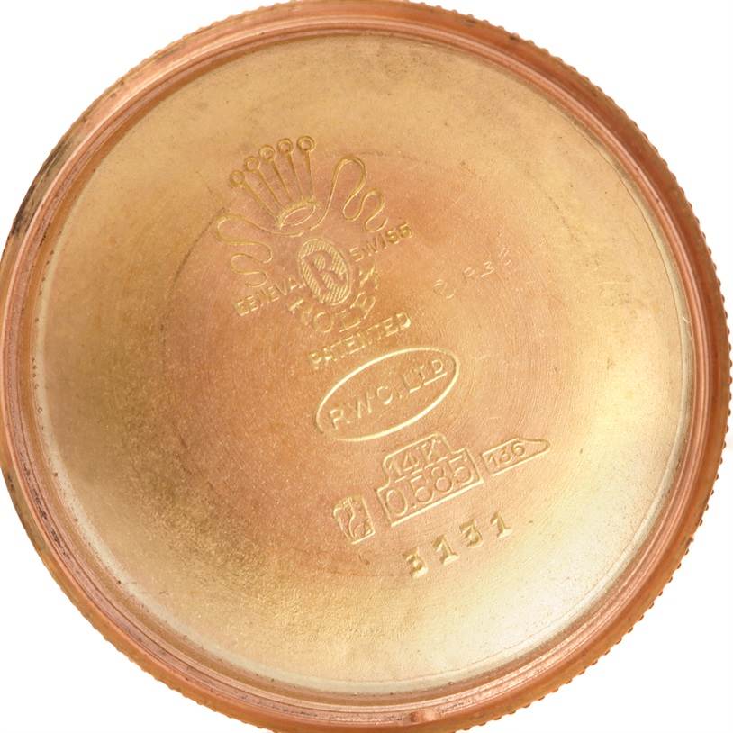 This image shows the inside case back of a Rolex Vintage Collection 3131 Men's Rose Gold Silver Dial 3131 Men's Rose Gold Silver Dial model, depicting engravings and hallmarks.