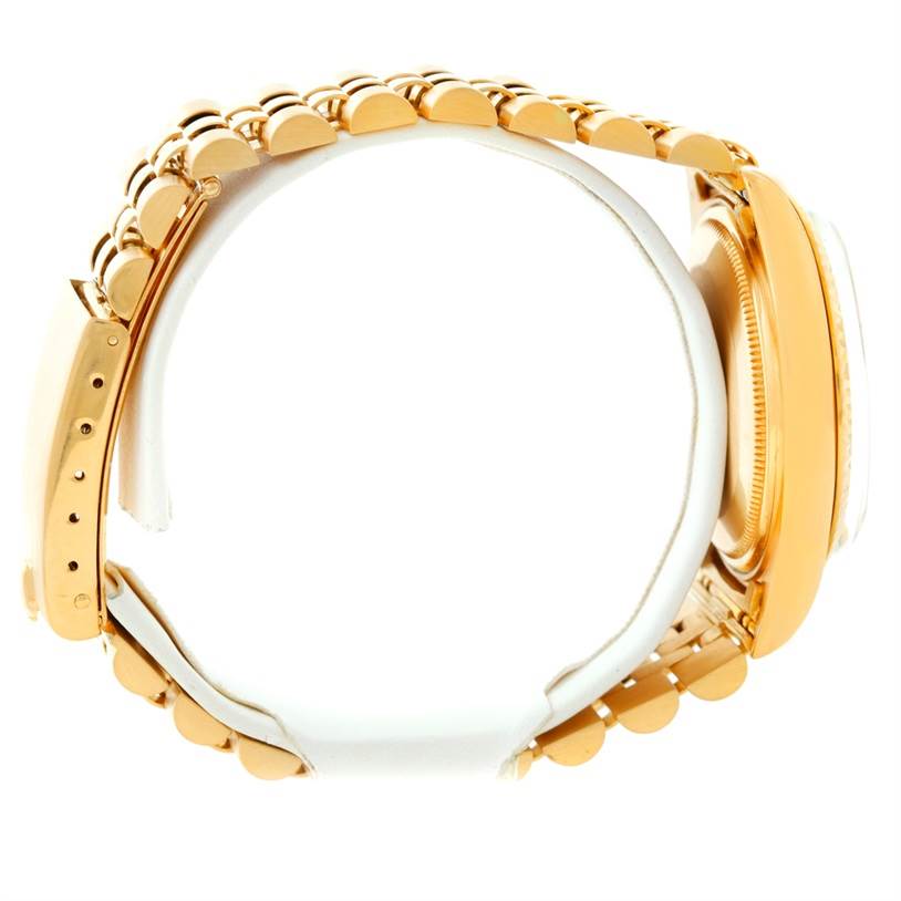 The image shows a side profile of the Rolex Vintage Collection 1601 Men's Yellow Gold Silver Dial 1601 Men's Yellow Gold Silver Dial watch, highlighting its gold case and metal bracelet.