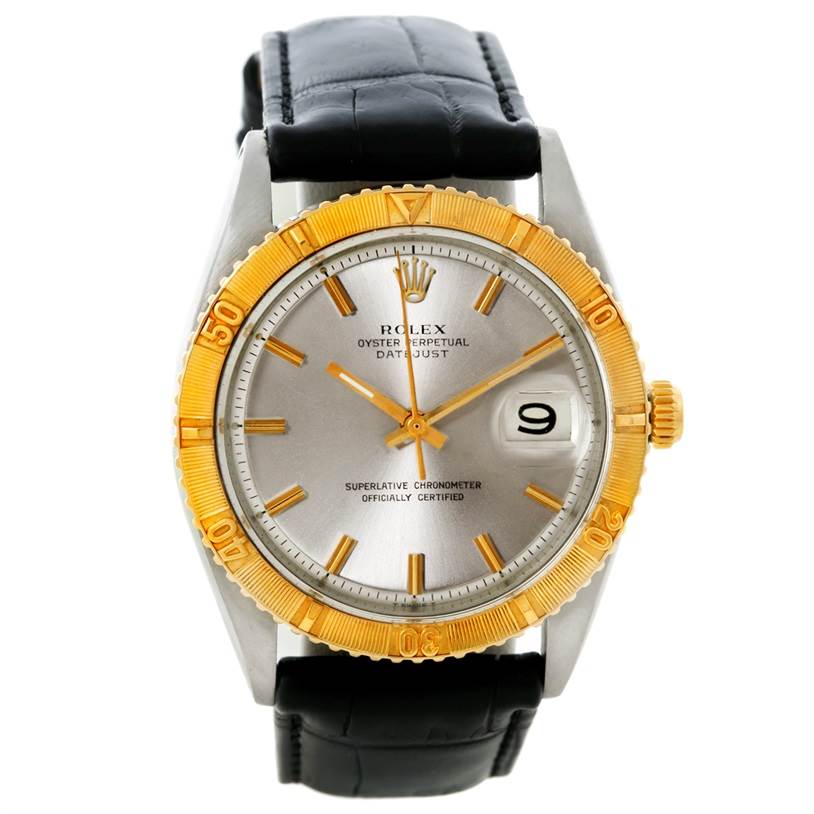The Vintage Collection Rolex watch is shown from a front angle, highlighting the dial, bezel, crown, and strap.