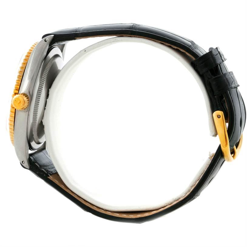 This image shows a side view of a Rolex Vintage Collection 1625 Men's Steel and Gold (two tone) Silver Dial 1625 Men's Steel and Gold (two tone) Silver Dial watch, highlighting the crown, case, and leather strap.