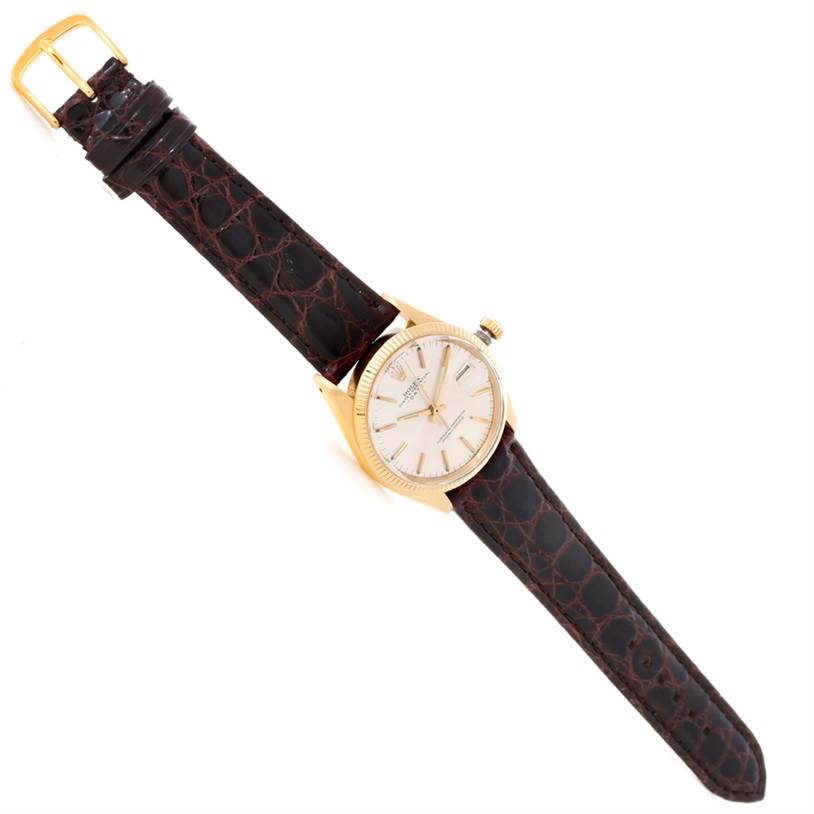 The Rolex Vintage Collection 1503 Men's Yellow Gold Silver Dial 1503 Men's Yellow Gold Silver Dial watch is shown at a slight angle, displaying its face, hands, case, crown, and leather strap with buckle.