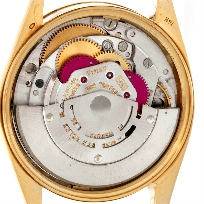 This image shows the inner mechanism of a Rolex Vintage Collection 1503 Men's Yellow Gold Silver Dial 1503 Men's Yellow Gold Silver Dial watch, highlighting the gears and movement parts.