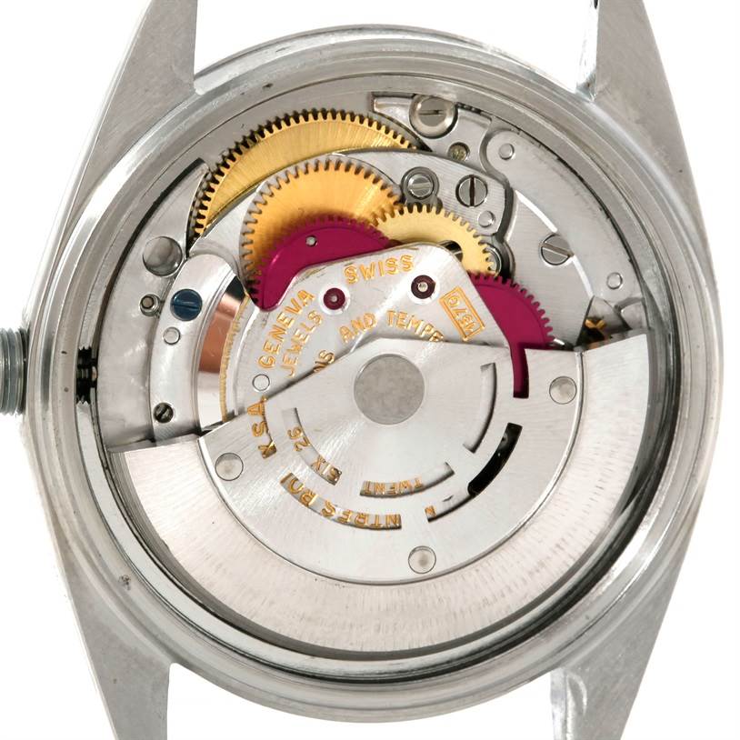 This image shows the inner mechanical components of the Rolex Vintage Collection 1603 Men's Stainless Steel Silver Dial 1603 Men's Stainless Steel Silver Dial watch from a back view, highlighting gears and movement.