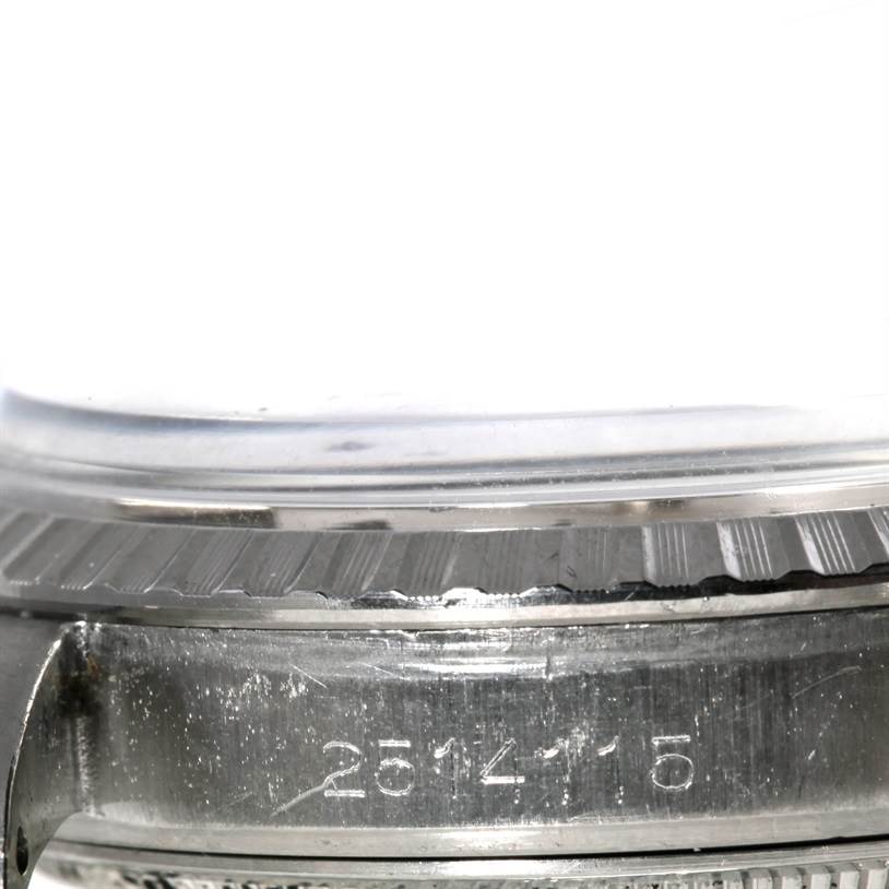 This close-up image shows the side case and serial number of a Vintage Collection Rolex watch.