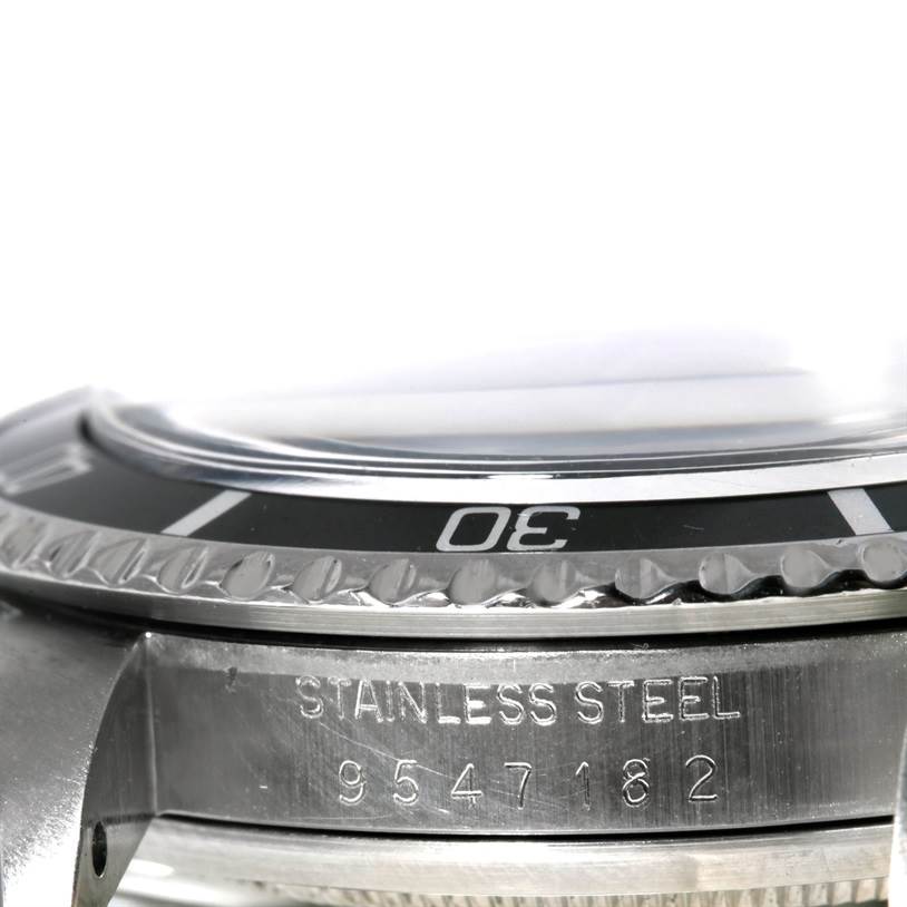 The image shows a close-up side view of the bezel and part of the stainless steel case of the Rolex Vintage Collection 5513 Men's Stainless Steel Black Dial 5513 Men's Stainless Steel Black Dial model watch.