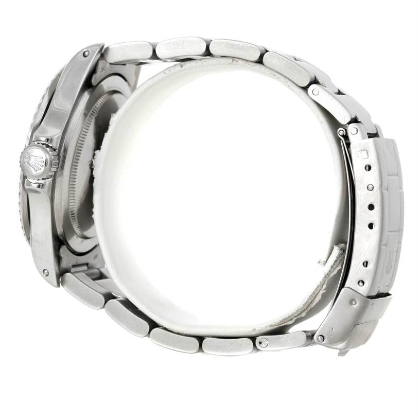 The image shows a side view of a Rolex Vintage Collection 5513 Men's Stainless Steel Black Dial 5513 Men's Stainless Steel Black Dial watch, highlighting its crown, bracelet, and clasp.