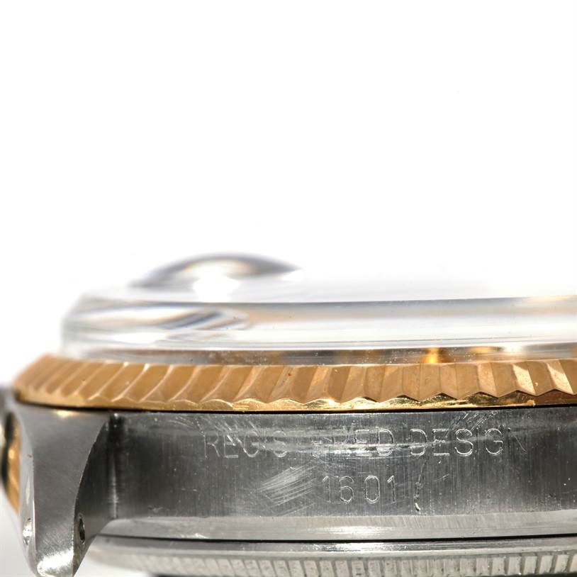 This close-up side view shows the bezel and part of the case of the Rolex Vintage Collection 1601 Men's Stainless Steel Silver Dial 1601 Men's Stainless Steel Silver Dial model 16013.