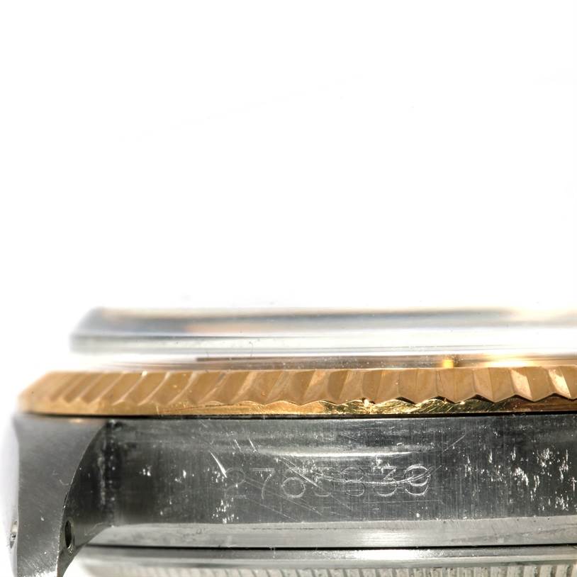 This image shows a side view of the Rolex Vintage Collection 1601 Men's Stainless Steel Silver Dial 1601 Men's Stainless Steel Silver Dial watch, focusing on the bezel and case.