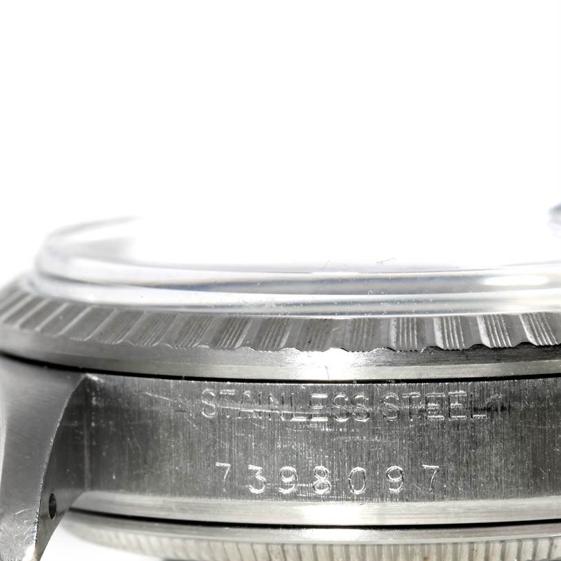This image shows a close-up of the stainless steel case and bezel of a Vintage Collection model by Rolex.