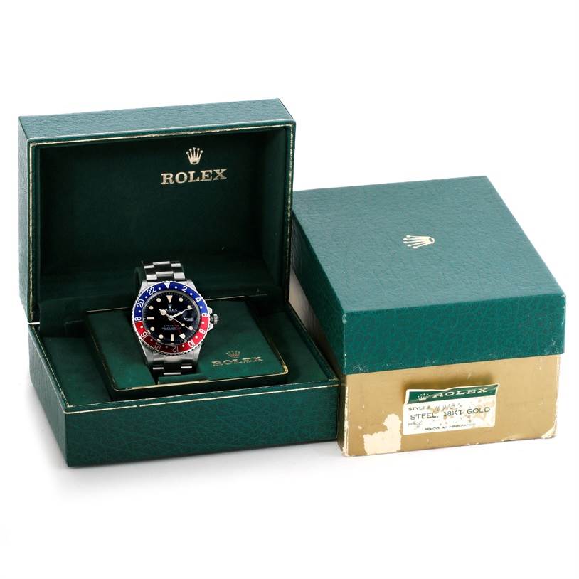 The image shows a Vintage Collection Rolex watch in its green box at a front angle, with both box and cover visible.