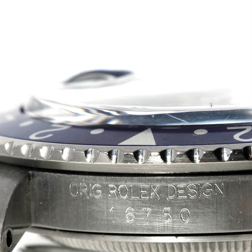 The image shows a close-up angle of the bezel and side of a Vintage Collection Rolex watch, highlighting its engraving.