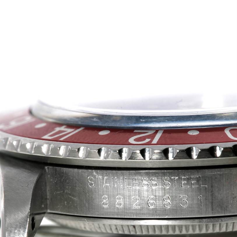 The image shows a close-up side view of the bezel, case, and serial number of the Rolex Vintage Collection 16750 Men's Stainless Steel Black Dial 16750 Men's Stainless Steel Black Dial watch.