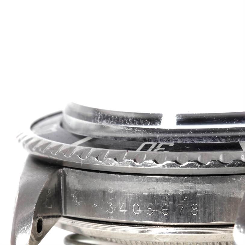 This image shows a side close-up of the bezel, case, and part of the crystal of a Rolex Vintage Collection 1680 Men's Stainless Steel Black Dial 1680 Men's Stainless Steel Black Dial model.