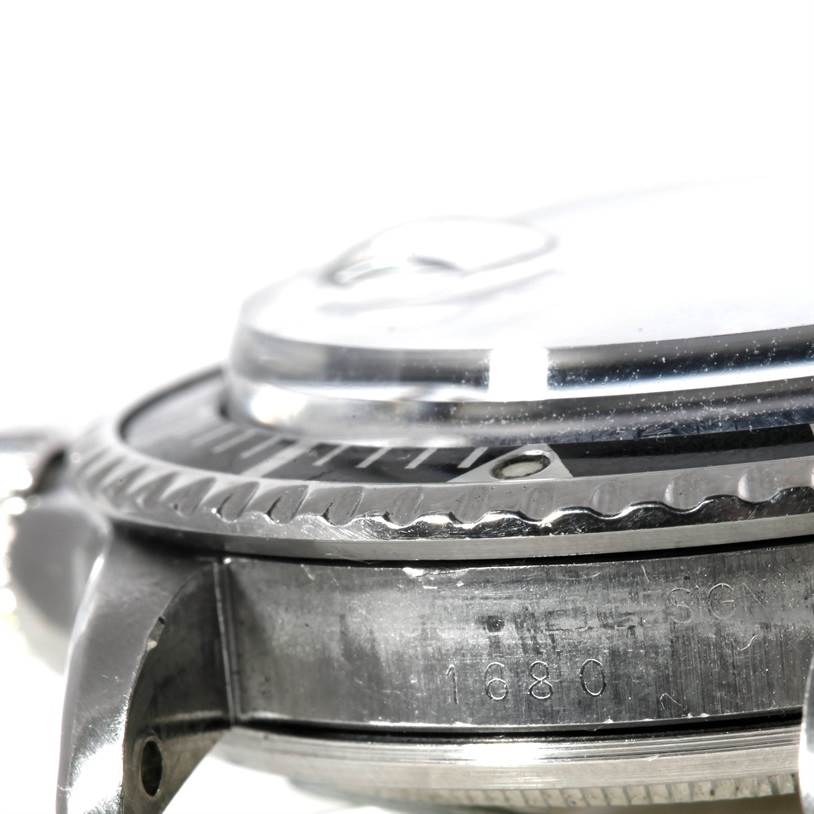 The image shows a close-up side view of the Rolex Vintage Collection 1680 Men's Stainless Steel Black Dial 1680 Men's Stainless Steel Black Dial model, highlighting the bezel and case details.