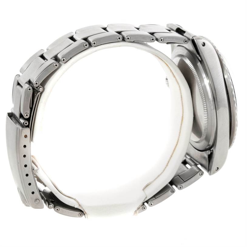 The image shows the side view of a Rolex Vintage Collection 1680 Men's Stainless Steel Black Dial 1680 Men's Stainless Steel Black Dial model, highlighting its strap and case.