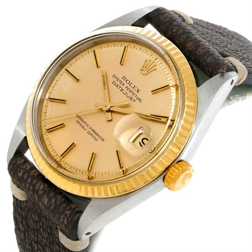 This Rolex Vintage Collection 1601 Men's Stainless Steel Champagne Dial 1601 Men's Stainless Steel Champagne Dial Oyster Perpetual Datejust watch is shown at a tilted angle featuring the dial, bezel, crown, and part of the strap.