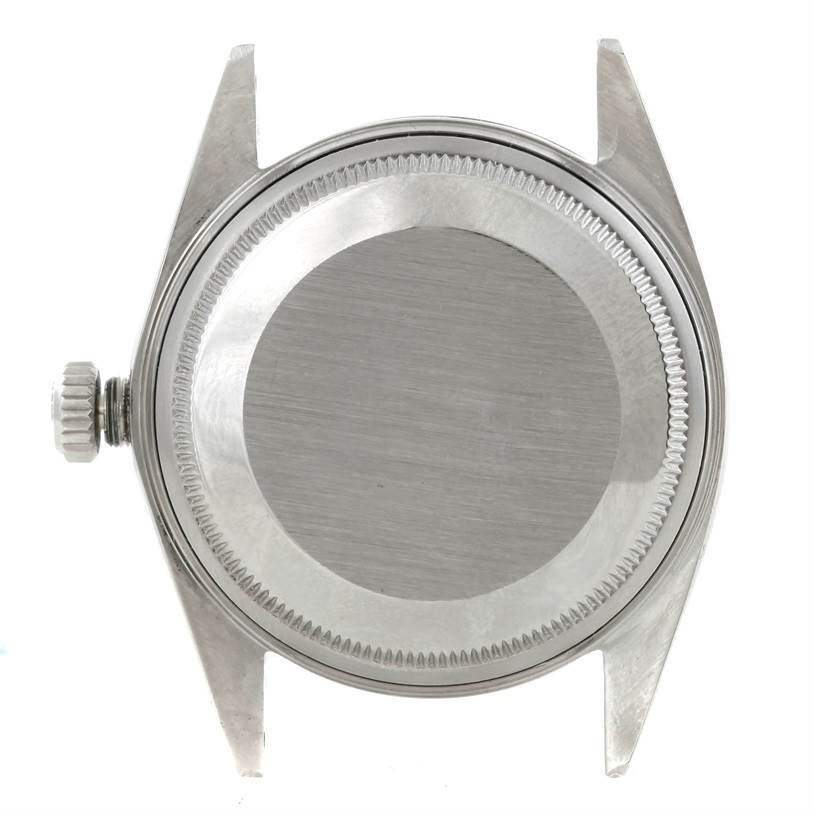 This image shows the back case and crown of a Vintage Collection watch by Rolex from a top-down angle.