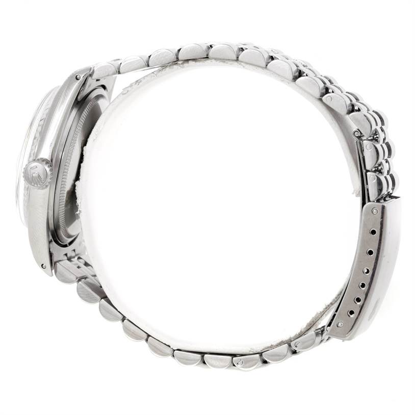 The image shows a side view of the Rolex Vintage Collection 1601 Men's Stainless Steel Silver Dial 1601 Men's Stainless Steel Silver Dial watch, highlighting the bracelet, side profile of the case, and crown.