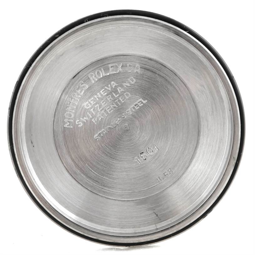 The image shows the inner case back of a Vintage Collection Rolex watch, highlighting the engraved branding and model information.