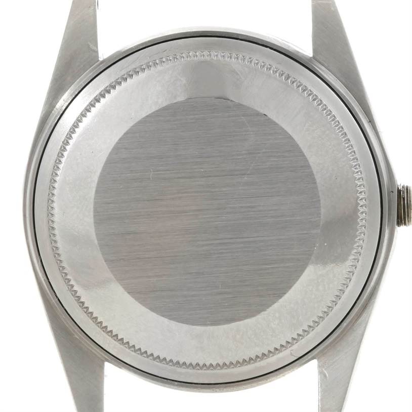 This image shows the back casing of the Vintage Collection Rolex watch from a straight-on angle.