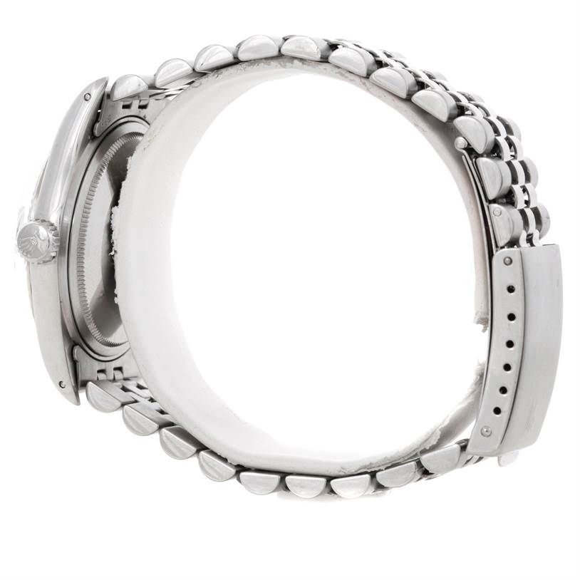 The side view of a Rolex Vintage Collection 1601 Men's Stainless Steel Silver Dial 1601 Men's Stainless Steel Silver Dial watch showcases the crown, case, and bracelet.