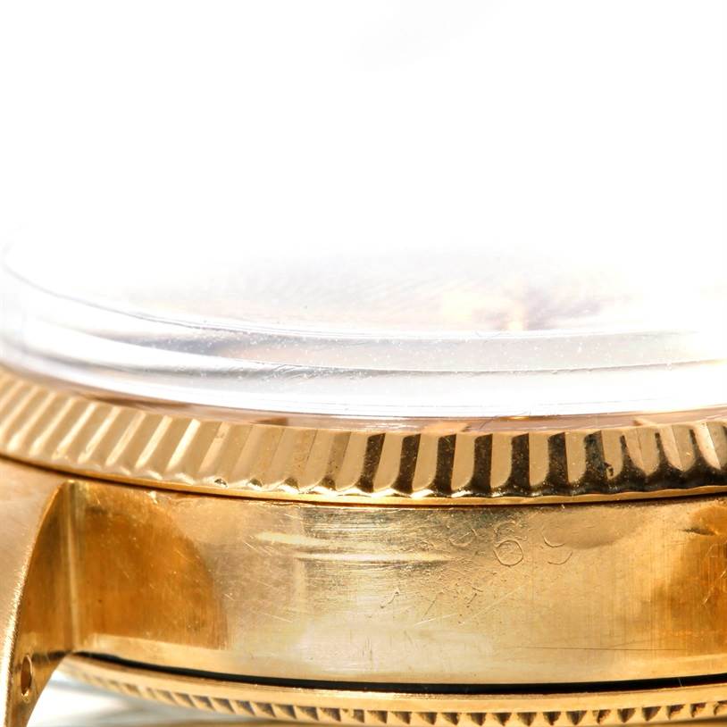 This close-up angle shows the side of the Rolex Vintage Collection 1005 Men's Yellow Gold Champagne Dial 1005 Men's Yellow Gold Champagne Dial watch case and bezel.