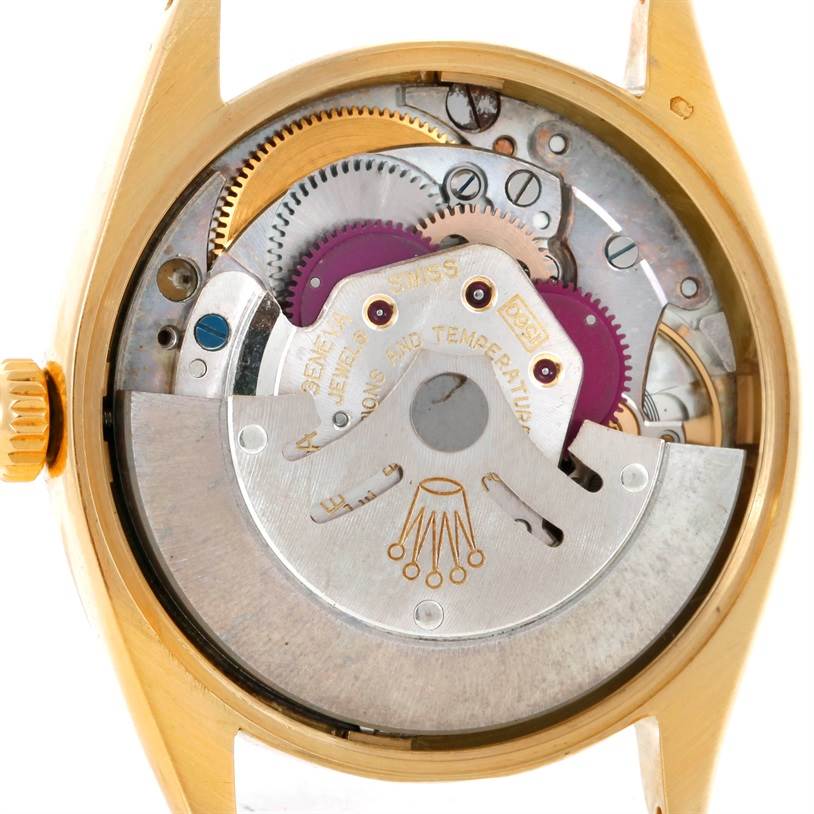 The image shows the rear view of a Rolex Vintage Collection 1005 Men's Yellow Gold Champagne Dial 1005 Men's Yellow Gold Champagne Dial model, revealing its internal mechanical components.
