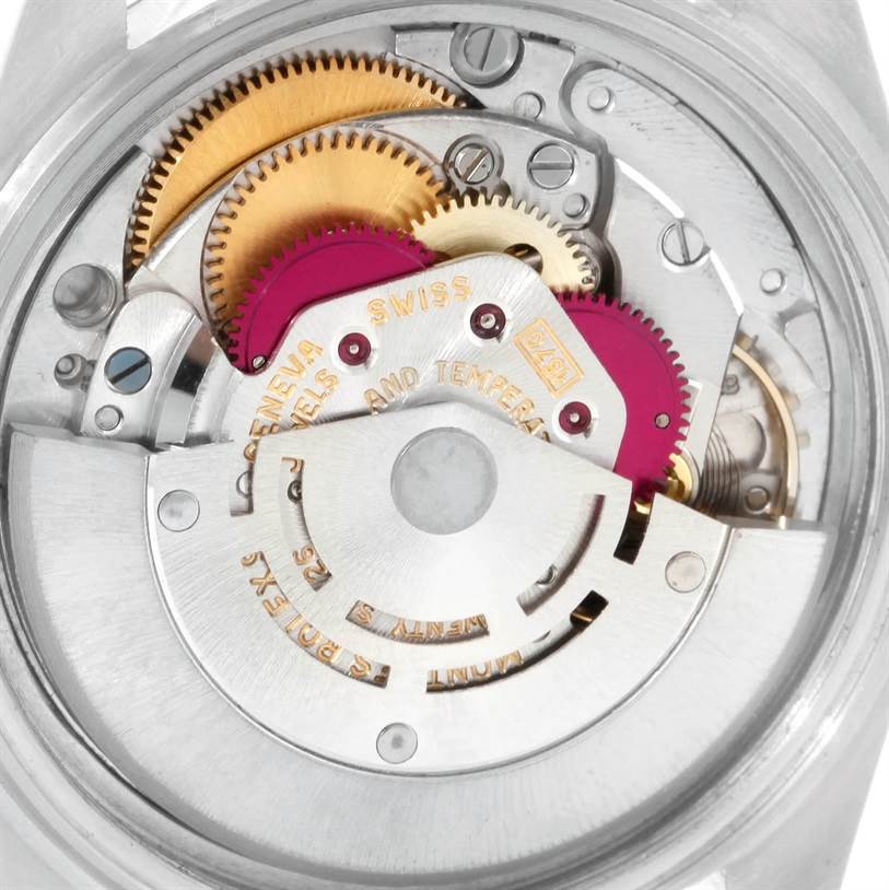 This image shows the intricate internal mechanism of a Rolex Vintage Collection 1601 Men's Stainless Steel Silver Dial 1601 Men's Stainless Steel Silver Dial watch, highlighting the gears and movement parts.