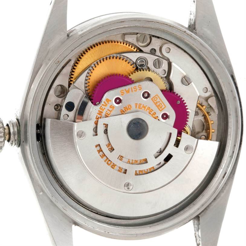 The image shows the internal movement of a Vintage Collection Rolex watch, viewed from the back.