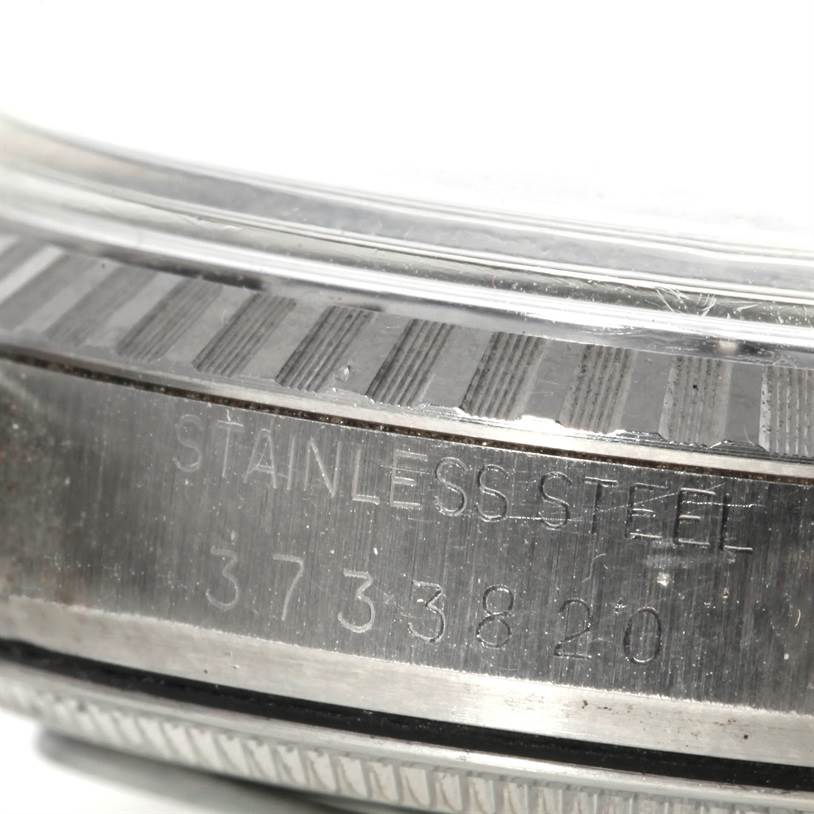 This image shows a close-up view of the stainless steel case and serial number of a Rolex Vintage Collection 1603 Men's Stainless Steel Grey Dial 1603 Men's Stainless Steel Grey Dial model watch.