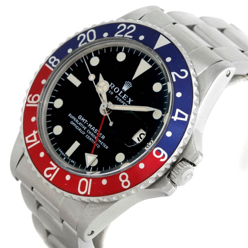 The image shows a Vintage Collection Rolex GMT-Master watch at an angle highlighting the face, crown, bezel, and part of the bracelet.
