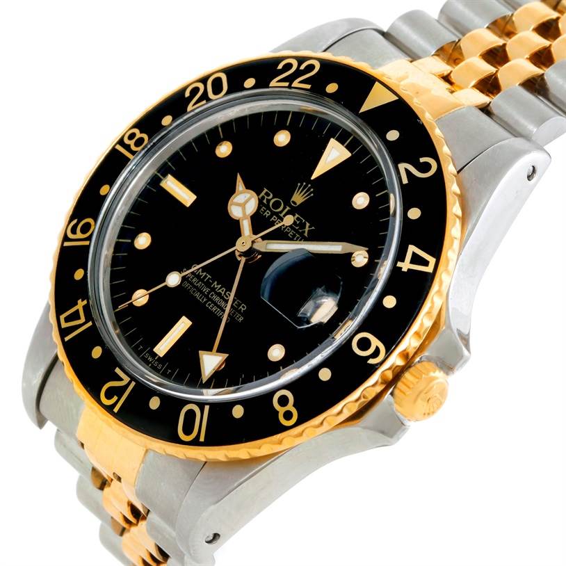 The Vintage Collection Rolex watch is shown at an angle highlighting the face, bezel, crown, and part of the bracelet.