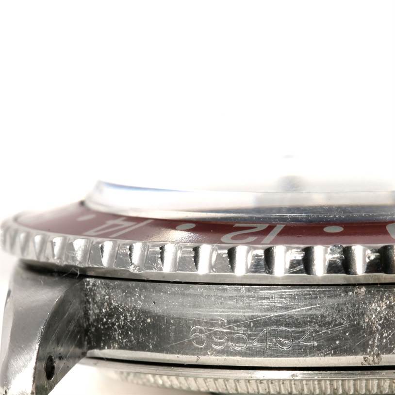 The image shows a close-up, side view of the bezel and case of the Vintage Collection model by Rolex.