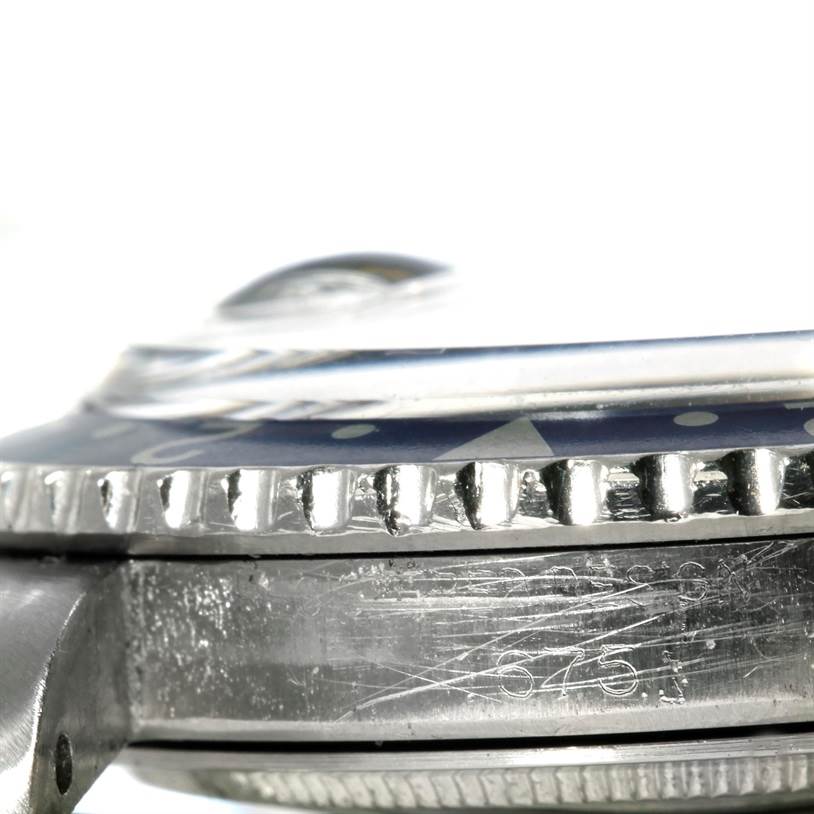 This image shows a close-up side view of the bezel and case of a Vintage Collection model by Rolex.