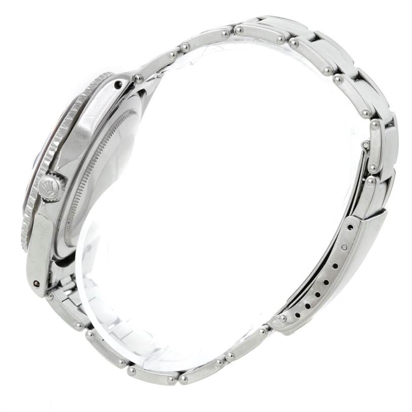 The image shows a side profile of a Rolex Vintage Collection 1675 Men's Stainless Steel Black Dial 1675 Men's Stainless Steel Black Dial watch, highlighting the case, bezel, crown, and metal bracelet.