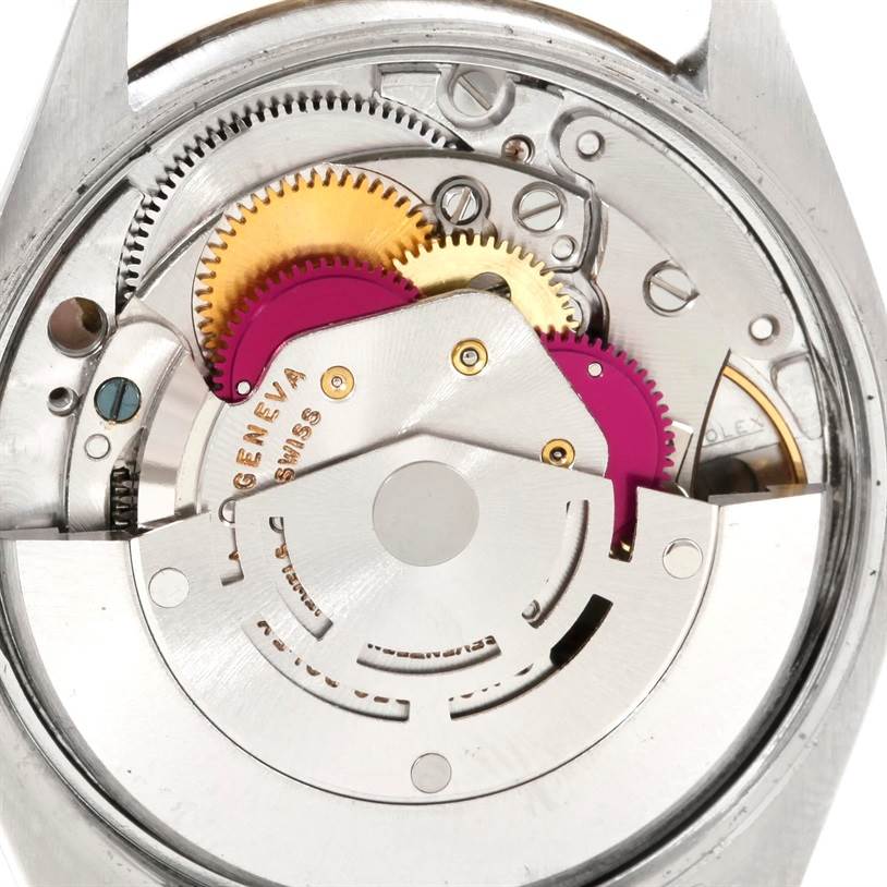 This image shows the internal mechanism and gears of a Vintage Collection Rolex watch viewed from the back.