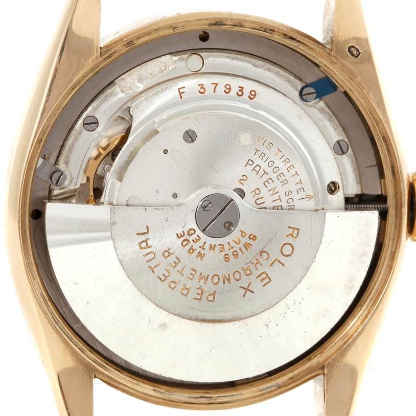 The image shows the internal movement mechanism of a Rolex Vintage Collection 6084 Men's Yellow Gold Silver Dial 6084 Men's Yellow Gold Silver Dial model from the back angle.