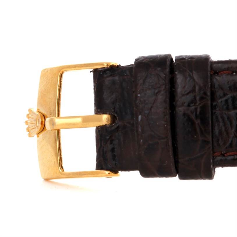 This image shows the leather strap and gold buckle of a Rolex Vintage Collection 6084 Men's Yellow Gold Silver Dial 6084 Men's Yellow Gold Silver Dial model watch, viewed from the side.