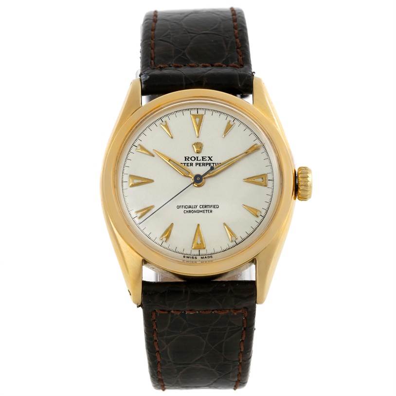 The image shows a front view of the Rolex Vintage Collection 6084 Men's Yellow Gold Silver Dial 6084 Men's Yellow Gold Silver Dial model with its dial, case, crown, and leather strap visible.