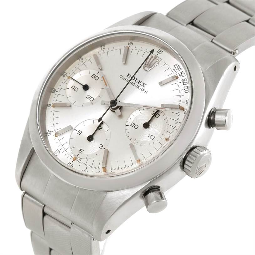 The image shows a Vintage Collection Rolex chronograph watch at a slight angle, highlighting the dial, push buttons, and part of the bracelet.