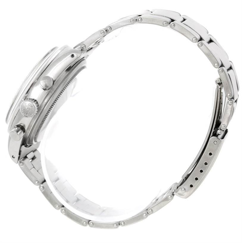 The image shows a side profile of a Rolex Vintage Collection 6238 Men's Stainless Steel Silver Dial 6238 Men's Stainless Steel Silver Dial watch, highlighting the crown, pushers, and metal bracelet.