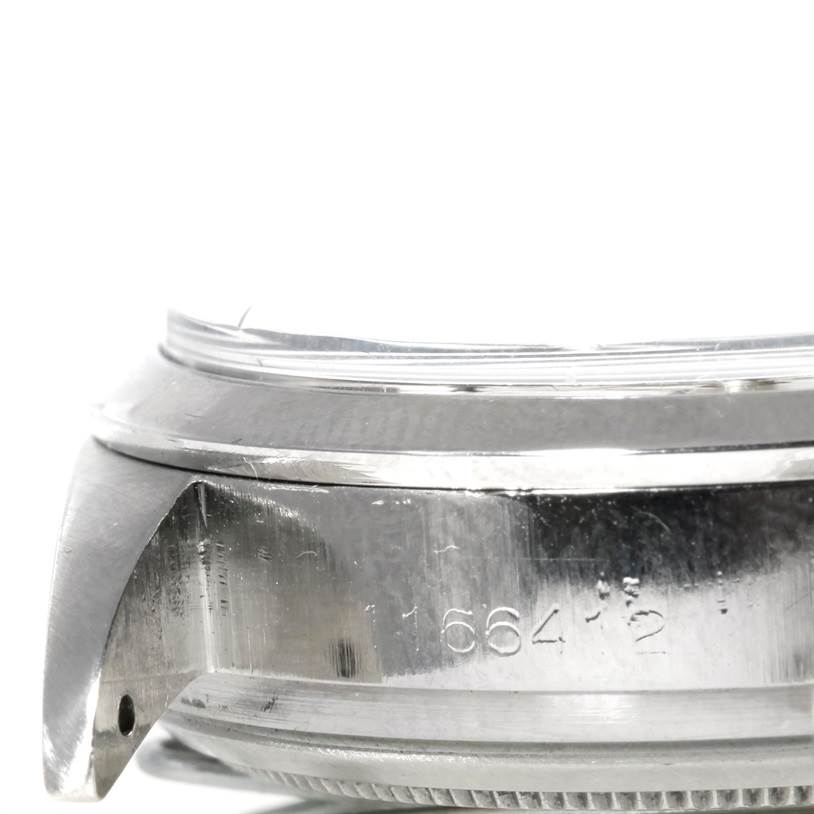 The image shows a close-up of the side profile of the Rolex Vintage Collection 6238 Men's Stainless Steel Silver Dial 6238 Men's Stainless Steel Silver Dial watch, highlighting the lugs and part of the bezel.