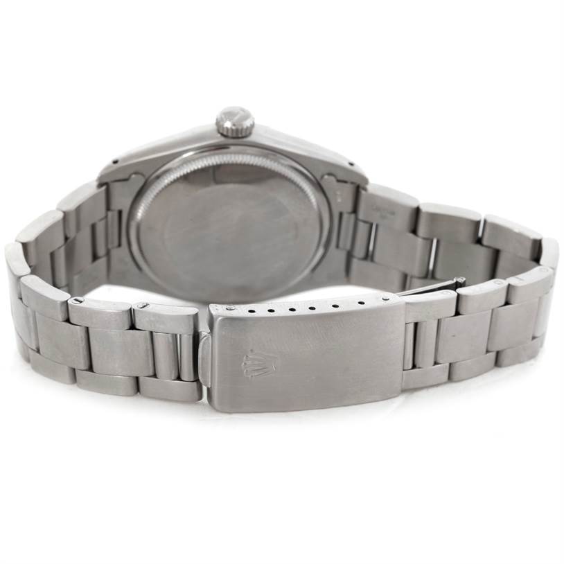 The image shows the back case and metal bracelet clasp of a Rolex Vintage Collection 1500 Men's Stainless Steel Blue Dial 1500 Men's Stainless Steel Blue Dial model watch.