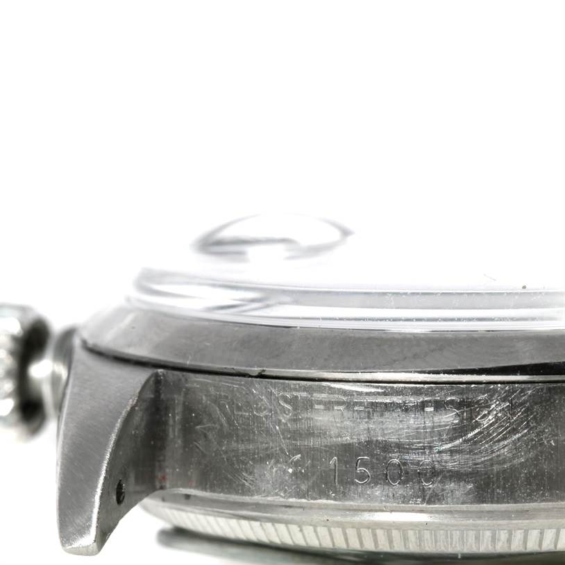 The image shows a close-up side view of the Rolex Vintage Collection 1500 Men's Stainless Steel Blue Dial 1500 Men's Stainless Steel Blue Dial model, featuring the watch case, bezel, and partially the crown.