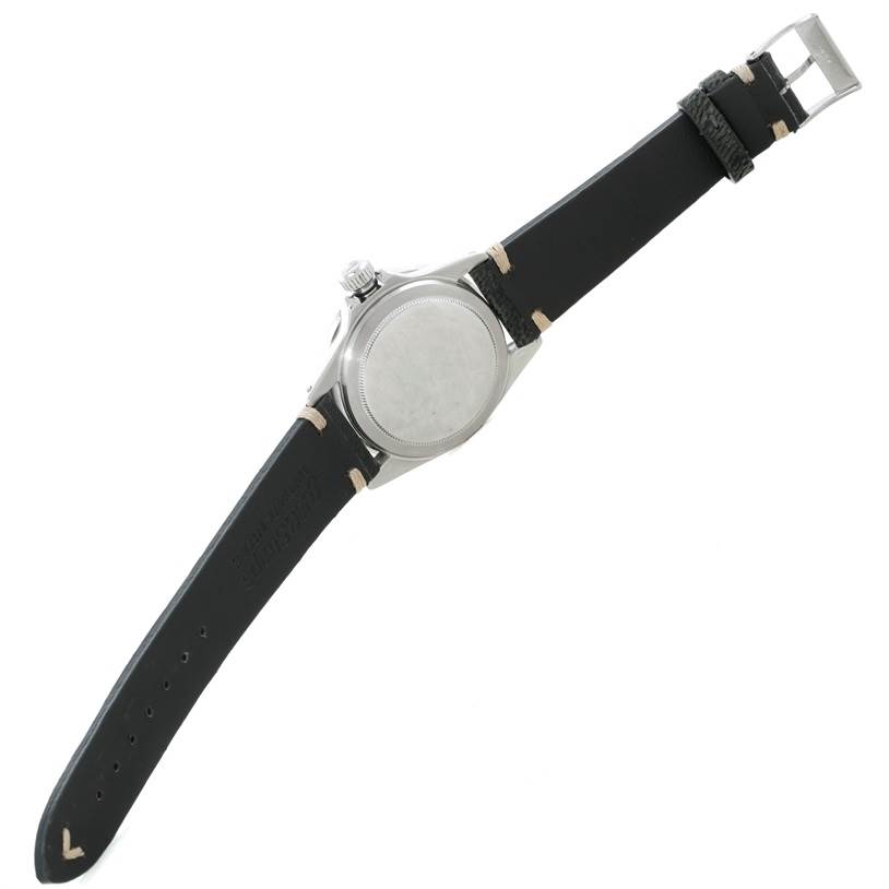 The image shows the back and strap of a Rolex Vintage Collection 1680 Men's Stainless Steel Black Dial 1680 Men's Stainless Steel Black Dial watch, displayed at an angled top-down view.